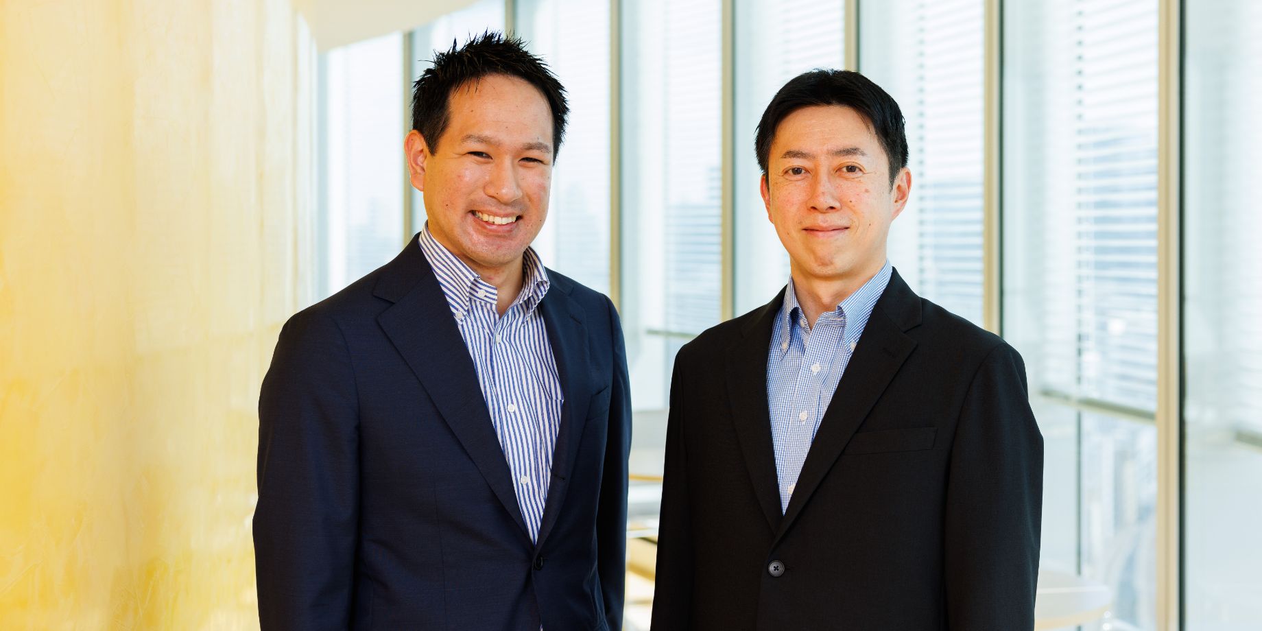 コーポレートPPA 主担当の所さん（左）と立ち上げに携わった法人営業第一部次長の松田さん（右）